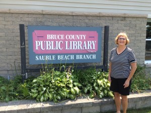 Maureen O'Shea in front of Sauble Beach Public Library